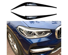 BMW Valoluomet X3 G01 G02 2018– – Kiiltävän musta. - BMW Headlight Covers X3 G01 G02 2018– – Glossy Black Evil Eye – Gloss black. - BMW Scheinwerferblenden X3 G01 G02 ab 2018 – Glänzend Schwarz (Böser Blick) – Glänzend schwarz.