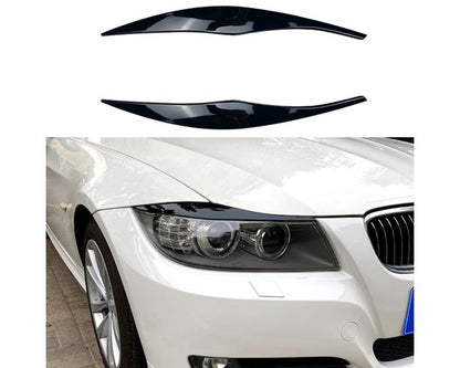 BMW Valoluomet E90 E91 2005–2012 – Kiiltävän musta. - BMW Headlight Covers E90 E91 2005–2012 – Gloss black. - BMW Scheinwerferblenden E90 E91 2005–2012 – Schwarz Glanz (Böser Blick) – Glänzend schwarz.